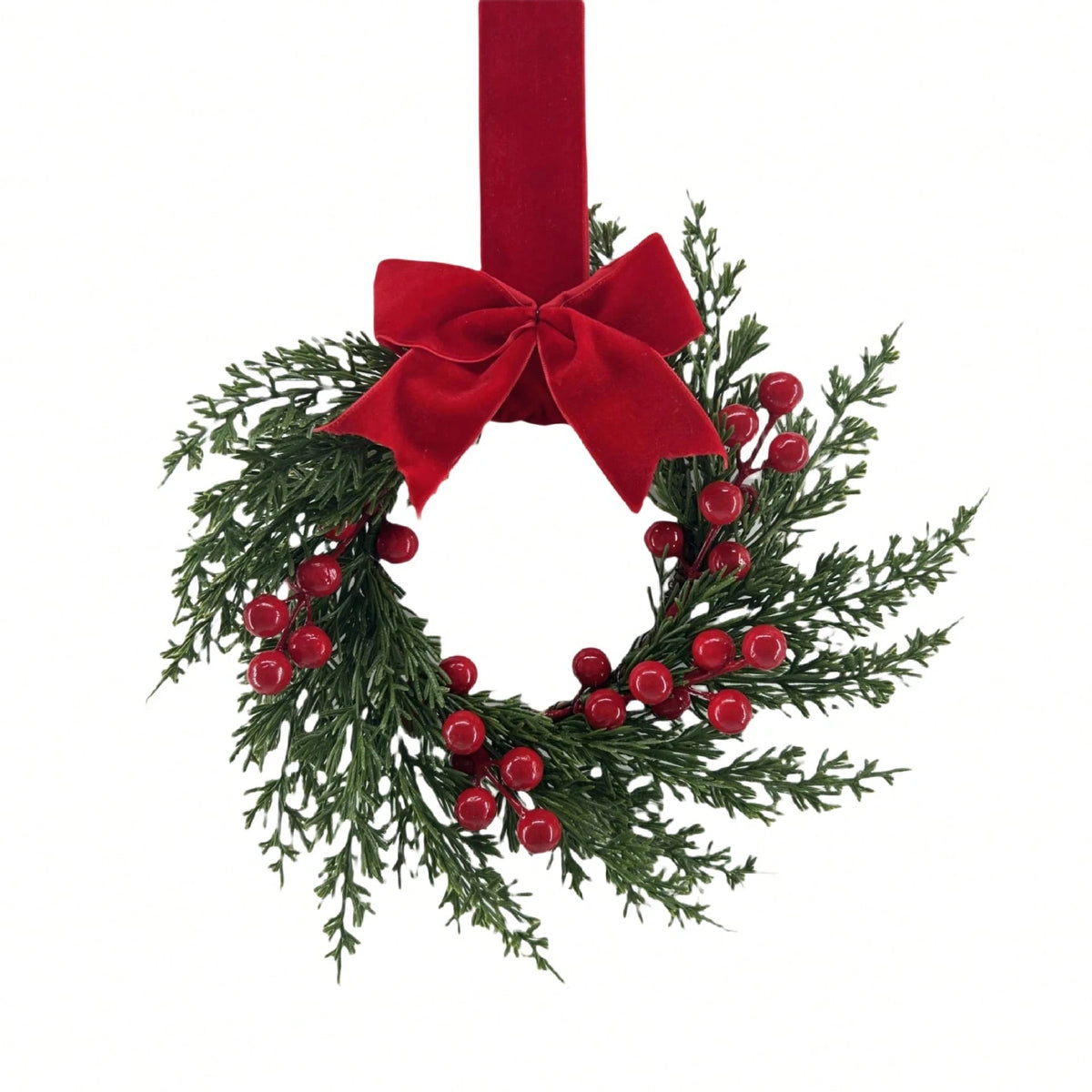 Set of two festive Christmas wreaths with green foliage and red ribbon for home decor