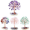 A decorative crystal money tree featuring purple and pink crystals on a wooden stand.