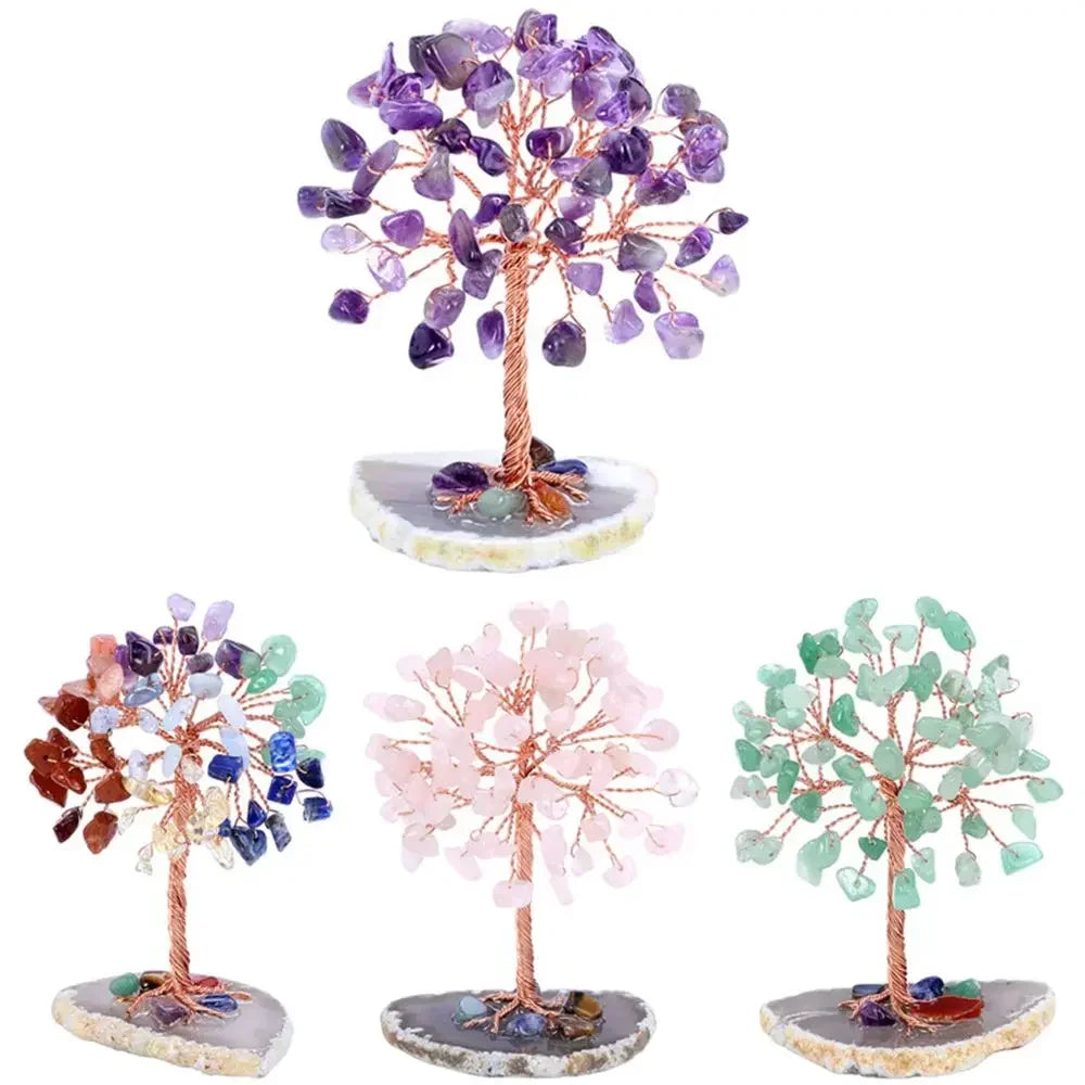 A decorative crystal money tree featuring purple and pink crystals on a wooden stand.