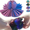 A hand holds a purple 3D printed gear ball fidget spinner with intricate teeth and colorful variations.