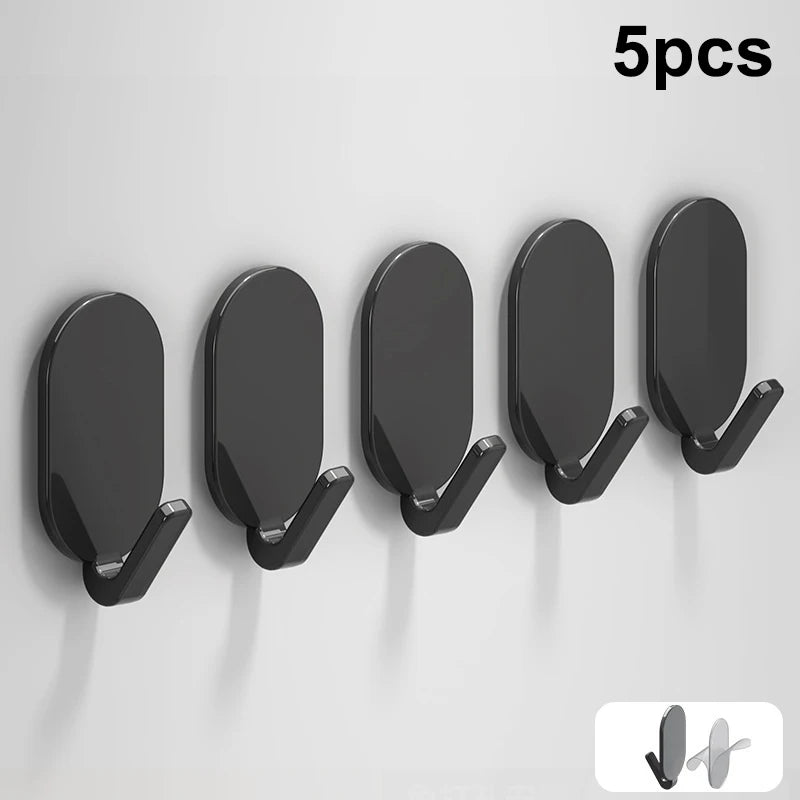 Five black self-adhesive wall hooks displayed in a row against a white background.