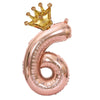 Rose gold foil balloon shaped like the number 6 with a gold crown on top