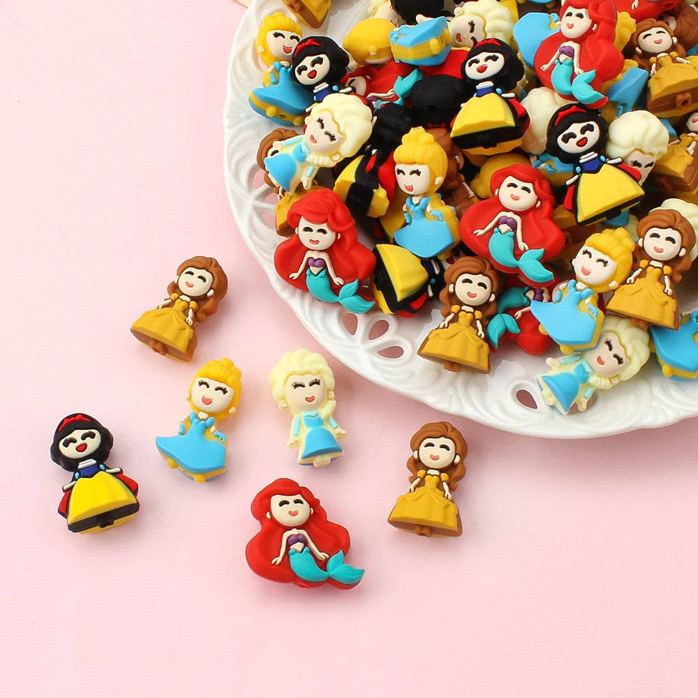 A collection of colorful 3D silicone plant beads in various shades of yellow, red, and blue arranged on a white plate.
