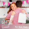 A woman is hugging a man while holding a white gift bag. The image is for Best Mom.