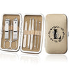 An open leather case displaying an 8-piece stainless steel manicure and pedicure kit with various tools.