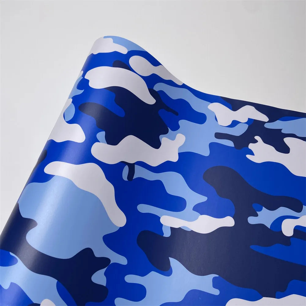 Blue and white digital camouflage vinyl wrap film rolled up