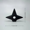 Black triangular ornament with a central hole, measuring 11.2 cm long and 8.5 cm high.