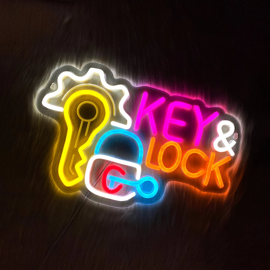 Neon wall sign featuring a key and lock silhouette with bright yellow, pink, and blue lights.