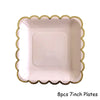 Eight 7-inch pink plates with gold scalloped edges