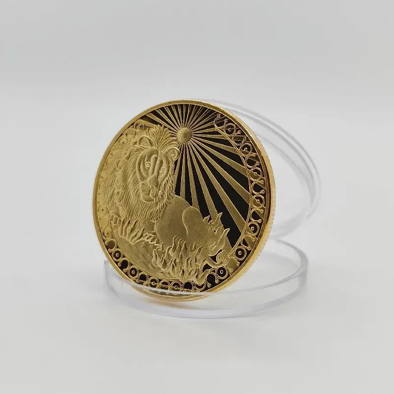 A round gold commemorative iron coin featuring a lion's head and a cat silhouette against a sunburst background.