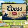 A large banner featuring the word Coors and a silhouette of a sunset over mountains.