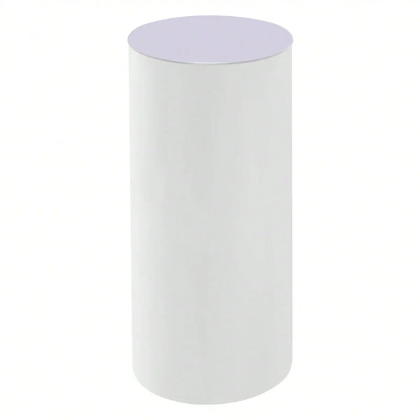 Set of three white cylinder pedestal display stands.