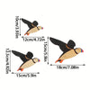 Set of three vintage wooden bird wall decorations in natural wood tones and orange accents.