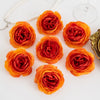 A cluster of vibrant orange and red silk peony artificial flowers displayed on a white surface.