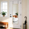 A full-length arched wall mirror with a gold aluminum frame hanging on a white door.