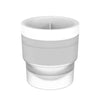 A white stackable spherical ice mold for whiskey and cocktails.