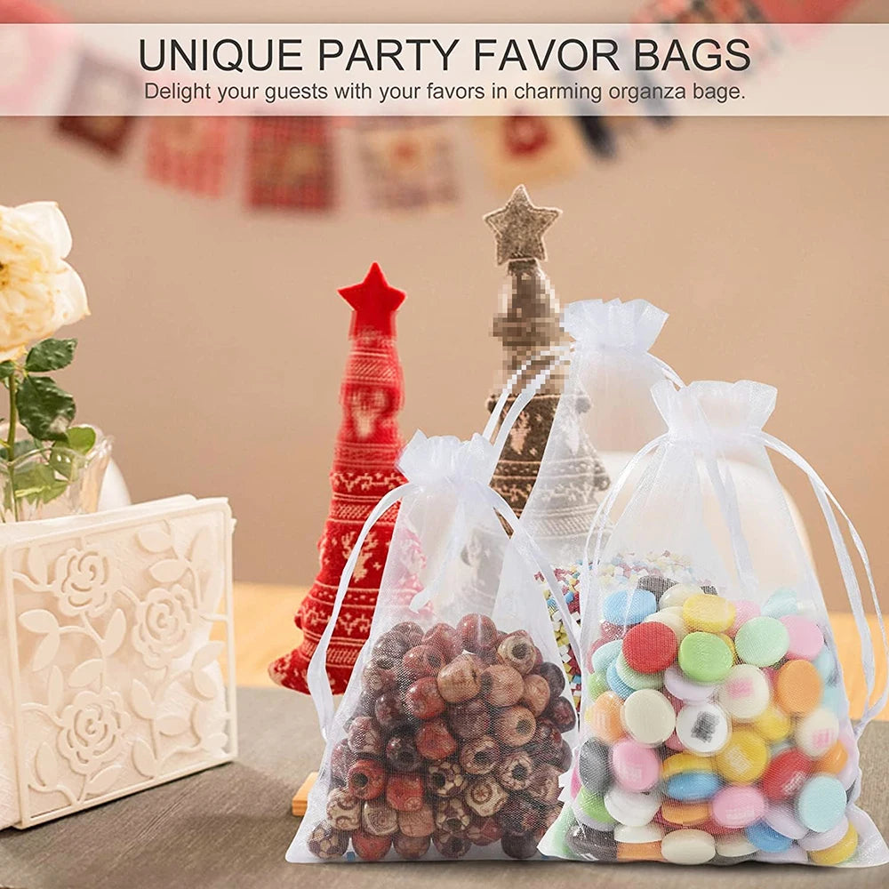 Unique party favor bags made of elegant white and gold drawstring organza filled with colorful candies