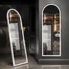 A full-length LED floor mirror with an arched frame and internal lighting displayed in a modern interior.