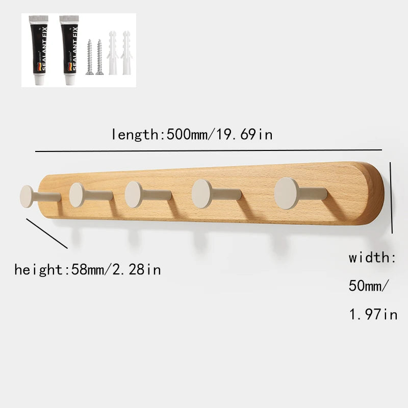 A wooden wall hook rack with four hooks made of solid beech wood.