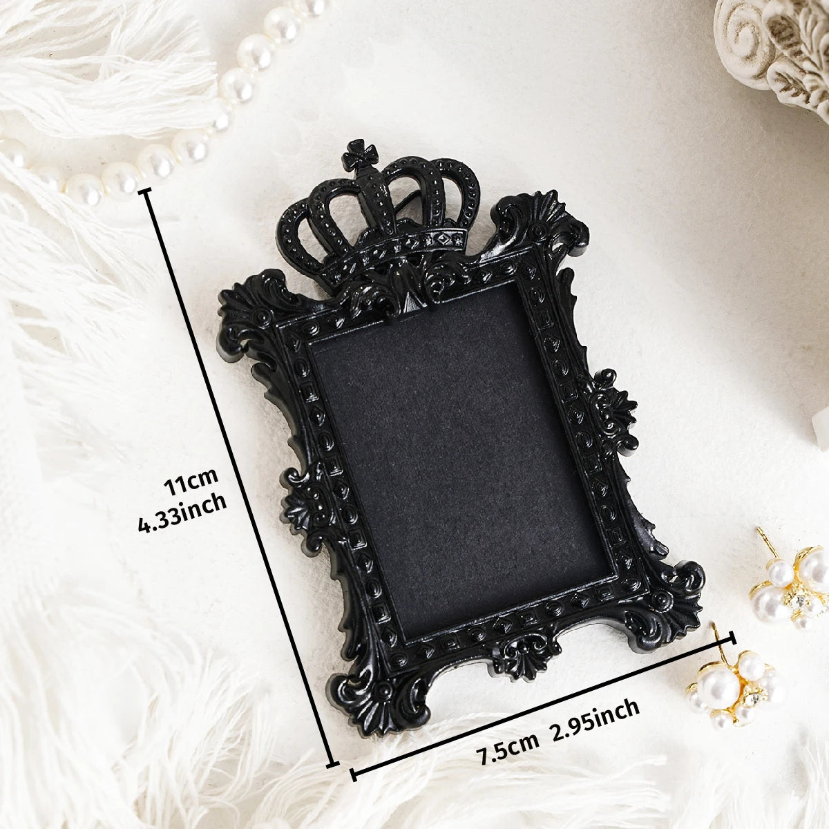 Black ornate frame for a wall decor pendant with white pearl accents
