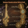 A collection of unique handcrafted brass witch bells featuring various charms and sizes.
