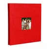 A red linen front scrapbook memory book with a photo of a family.