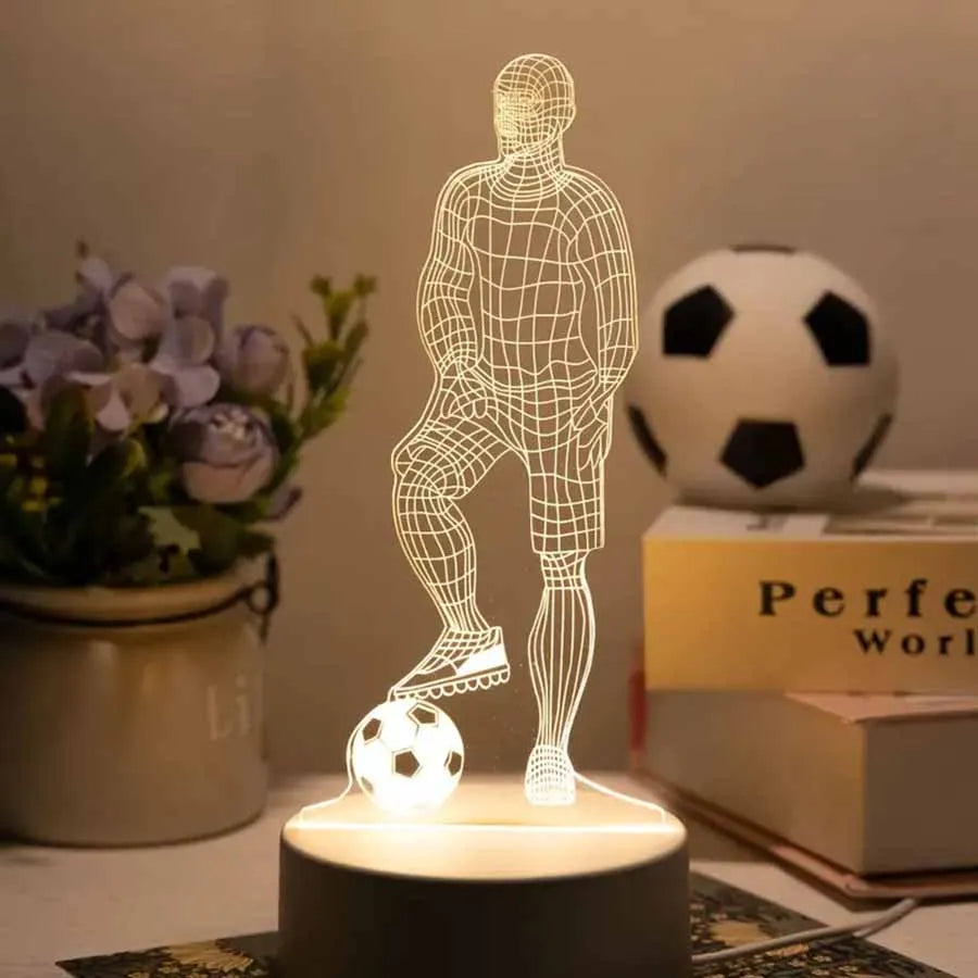 A glowing wireframe figure of a person in a football pose illuminates a soccer ball on a dark surface.