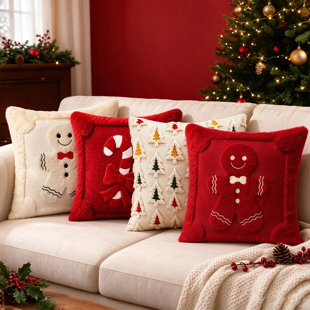 A collection of red and white candy cane shaped Christmas pillows displayed on a light sofa.