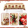 Vintage Christmas tablecloth featuring poinsettia and bell designs on a table.