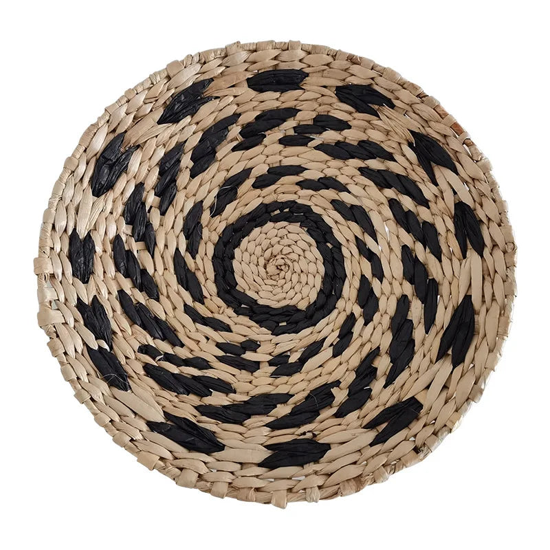 Round woven straw wall decor hanging with black and natural beige stripes