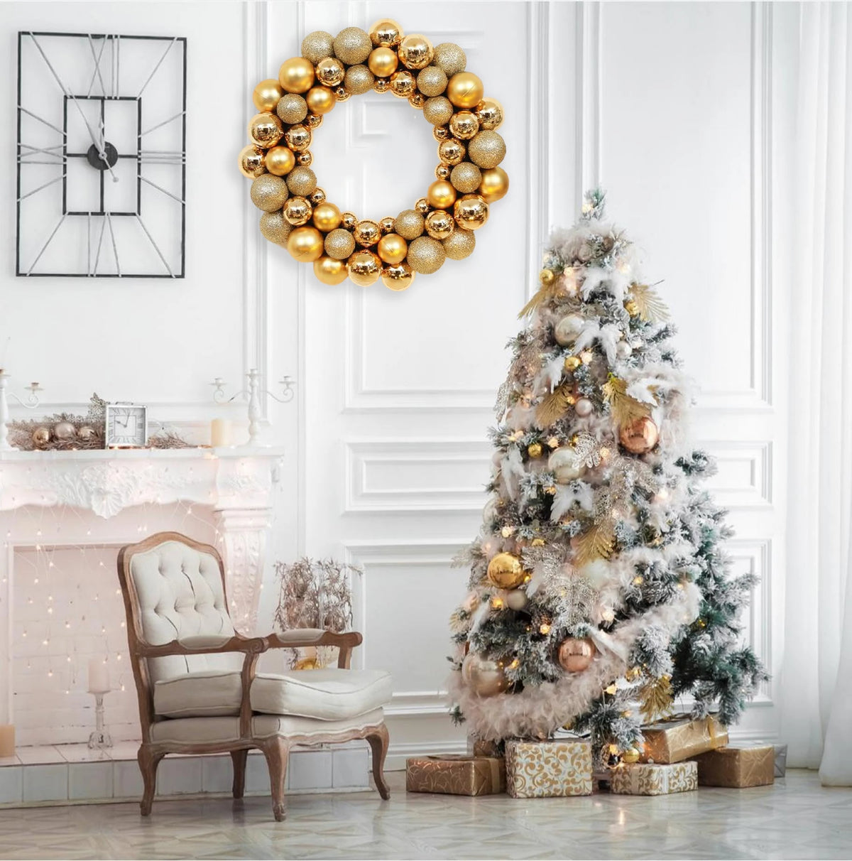 A golden silk Christmas ball wreath ornament displayed on a white wall next to a decorated Christmas tree and antique chair.