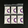 Five packs of clear protective card sleeves with purple and white labels are displayed on a dark surface.