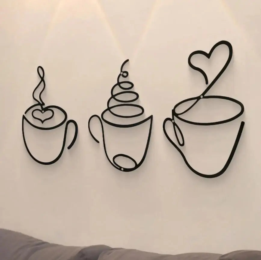 A trio of black metal wall art featuring stylized teacups with hearts and swirling steam.