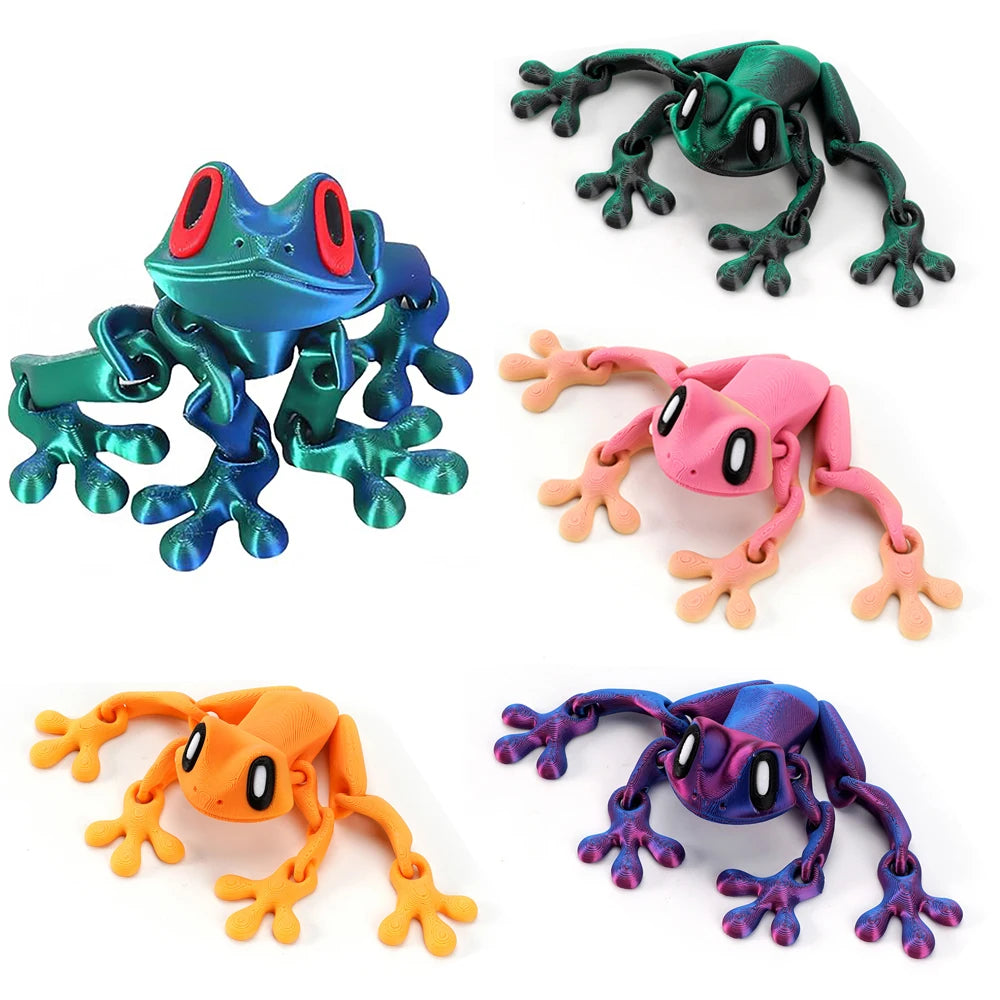 Four articulated 3D printed frog magnets in various colors including teal, pink, orange, and purple.