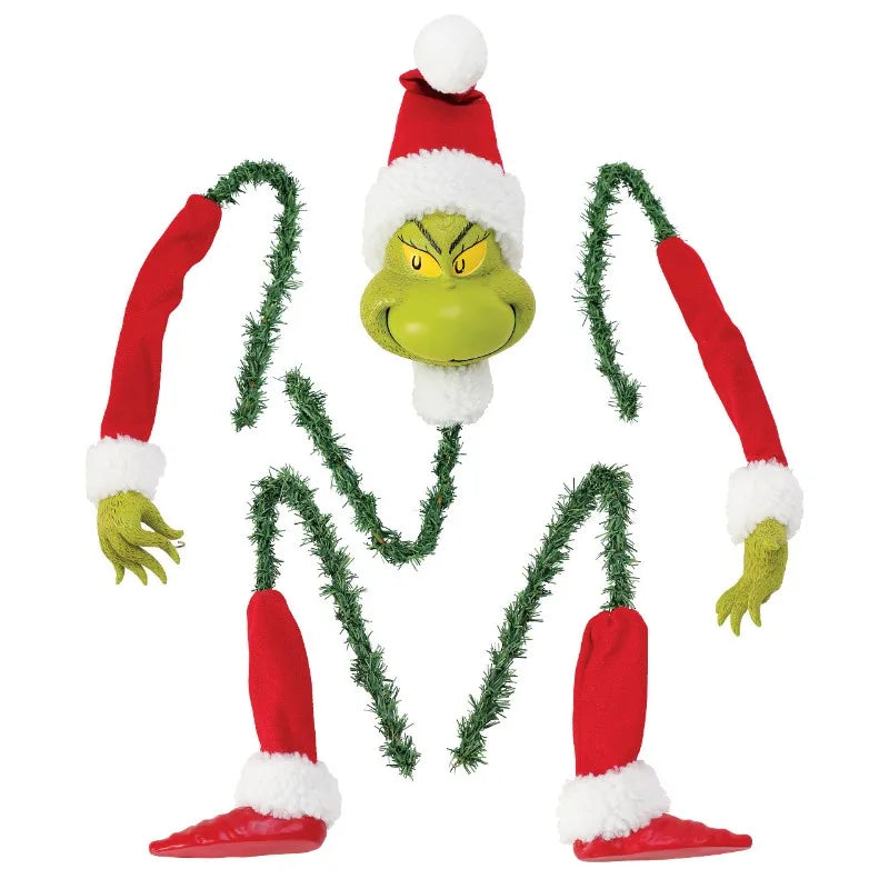 Green monster Christmas wall decor featuring a festive gift bag design