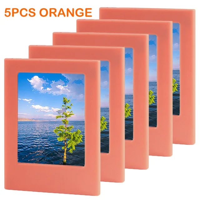 Five orange magnetic photo frames displaying a scenic landscape and trees.