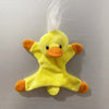 A yellow plush toy resembling a duck with orange accents and white feathers.