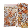 A close-up view of shiny gold foil flakes mixed with silver and copper flakes for resin art and jewelry making