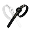 A black adjustable ring sizer with a white band and built-in magnifier tool.