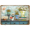 A vintage metal tin sign featuring a still life of flowers, glass dome, and books on a wooden surface.