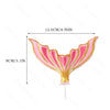 Pink mermaid tail cake topper featuring sea star and seashell decorations on a stick