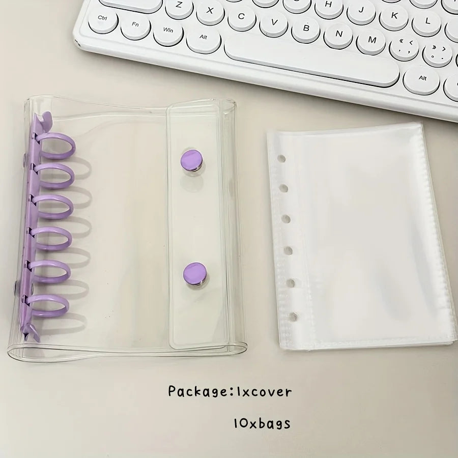 A clear plastic binder cover with purple accents and a white fabric pouch for storing collectibles.