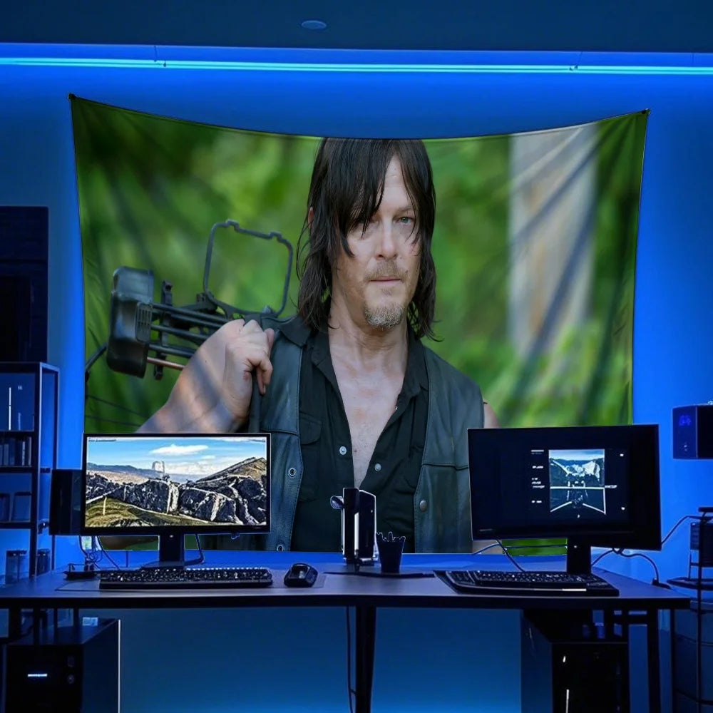 A man with long dark hair is shown in a video call on a computer screen, set against a blue light background.