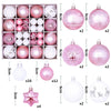 A collection of pink and white glass Christmas ball ornaments in various sizes and designs.