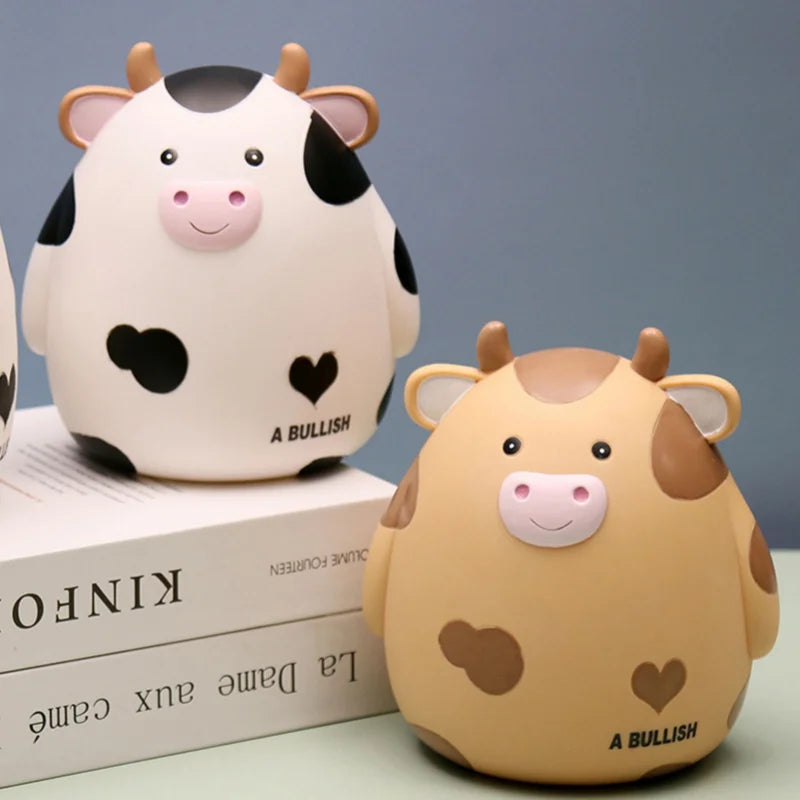 A cute, light-colored ceramic bull figure used as a money saving jar for kids.