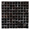 A grid of glossy black square panels used as a wall backdrop.