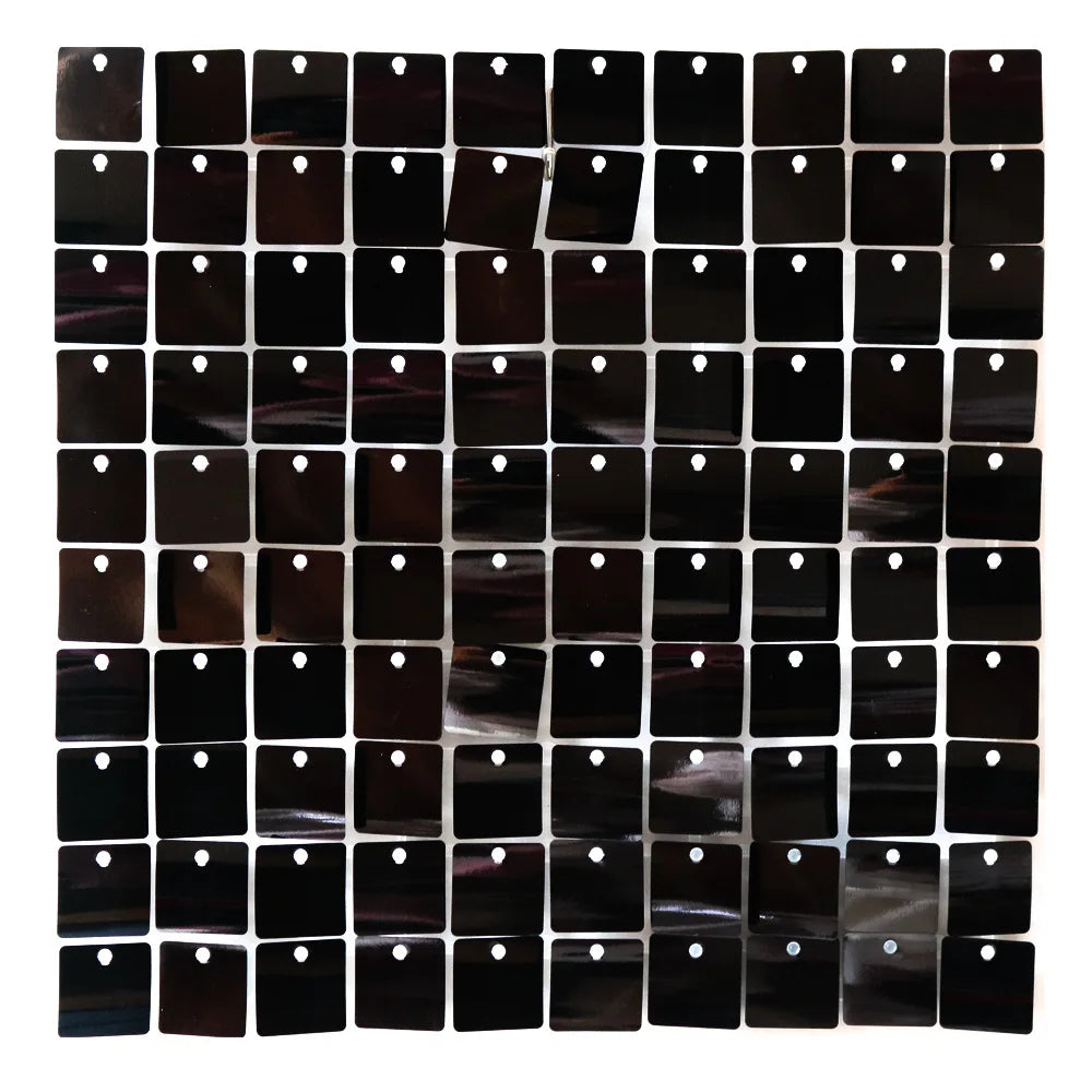 A grid of glossy black square panels used as a wall backdrop.