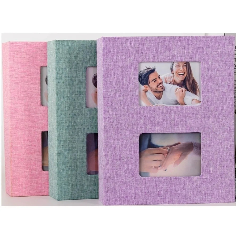 A purple linen-covered photo album with two visible photo pockets showing a couple.