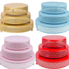 Three stacks of decorative metal cake stands in gold, light blue, and red for dessert display
