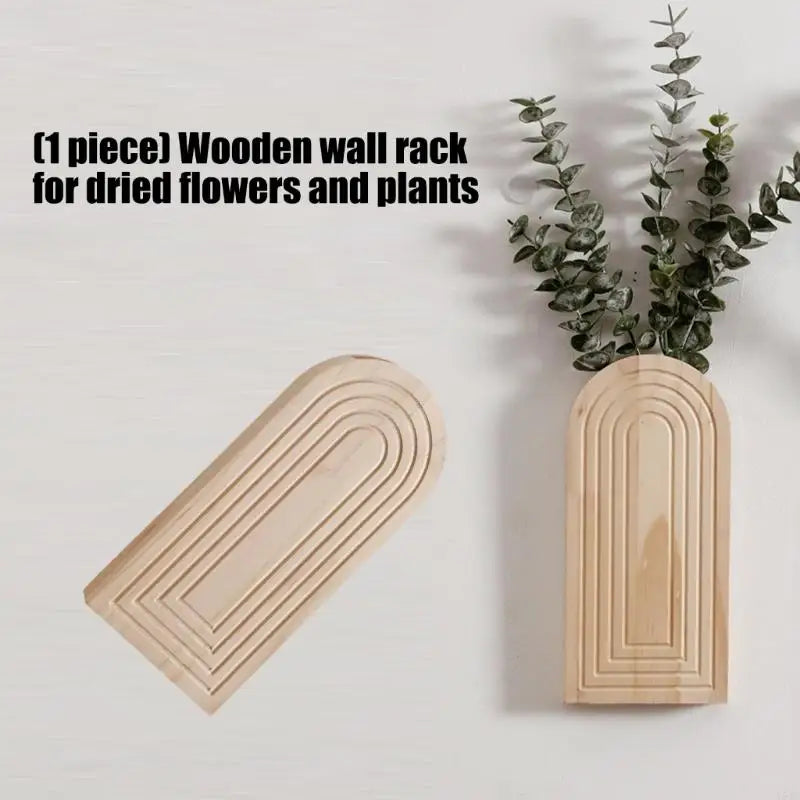 A light wood wall rack for displaying dried flowers and plants.